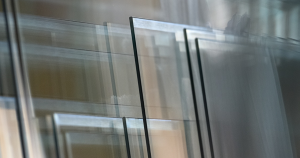 Cross-section of laminated impact glass showing two glass plies bonded to an interlayer for impact French doors