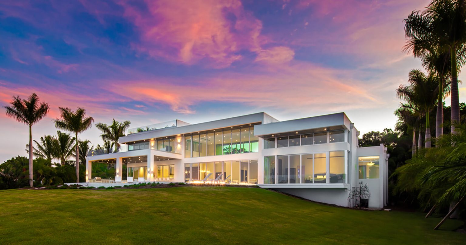 Residential impact windows and sliding glass doors on a Sarasota-area waterfront home