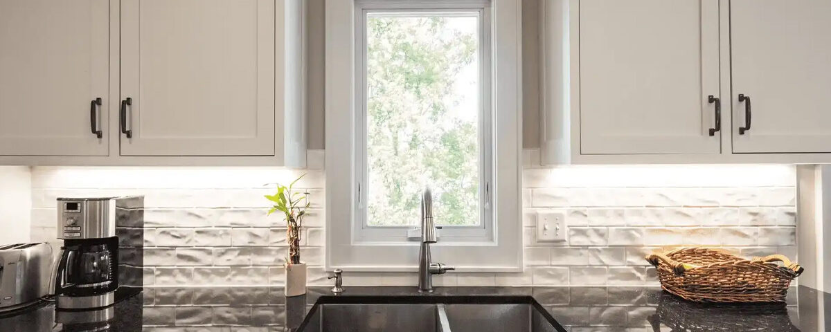 Marvin casement and awning windows remain popular over a kitchen sink. Both windows use a crank handle to open and close the window. Having a handle that extends out makes opening and closing the window easier.