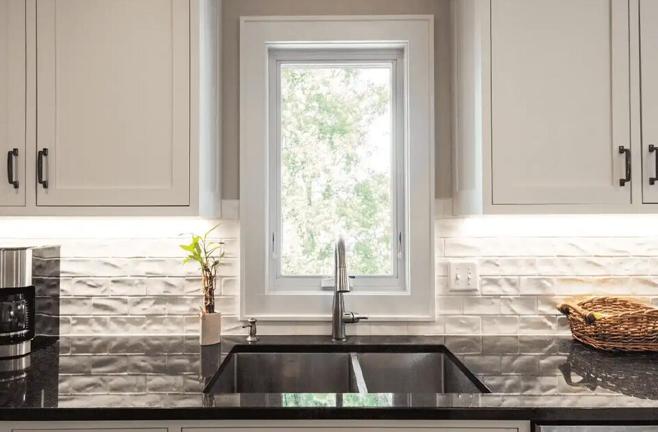 Marvin casement and awning windows remain popular over a kitchen sink. Both windows use a crank handle to open and close the window. Having a handle that extends out makes opening and closing the window easier.